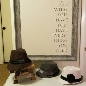 Three unique fedora hats, sold individually.